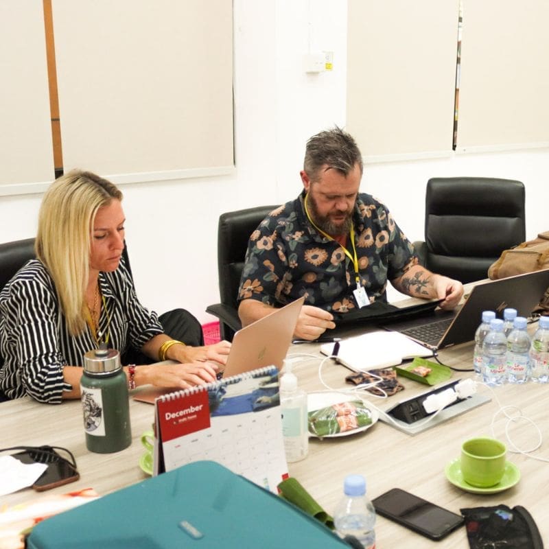 Manufacturing Strategy Session a manufacturing plan meeting in a clothing factory