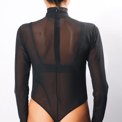 A girl in a sheer bodysuit