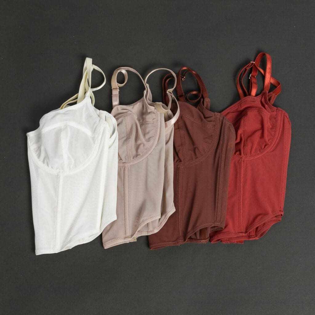 Four pricey lingerie tops shown in different colors
